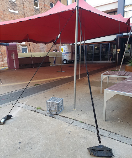 Stretch Tent attached to concrete floor