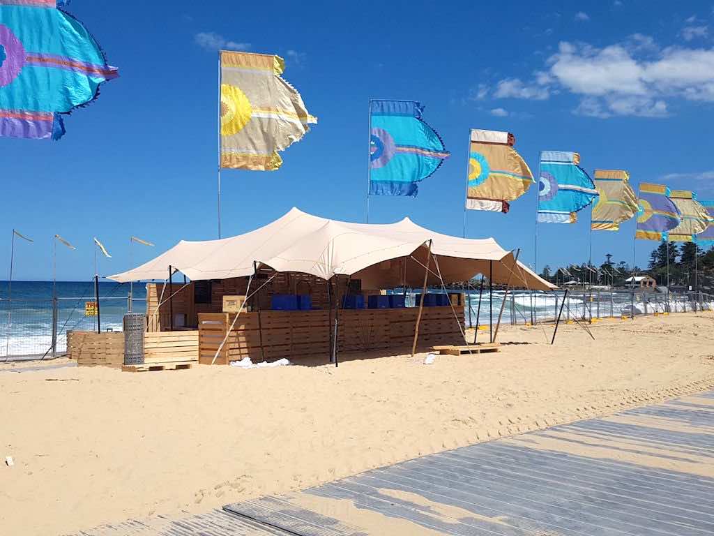Corona SunSets Festival - stretch tent installation on sand