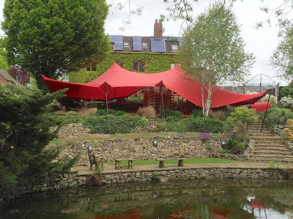 covered by canvas - stretch tent installed over tiered garden