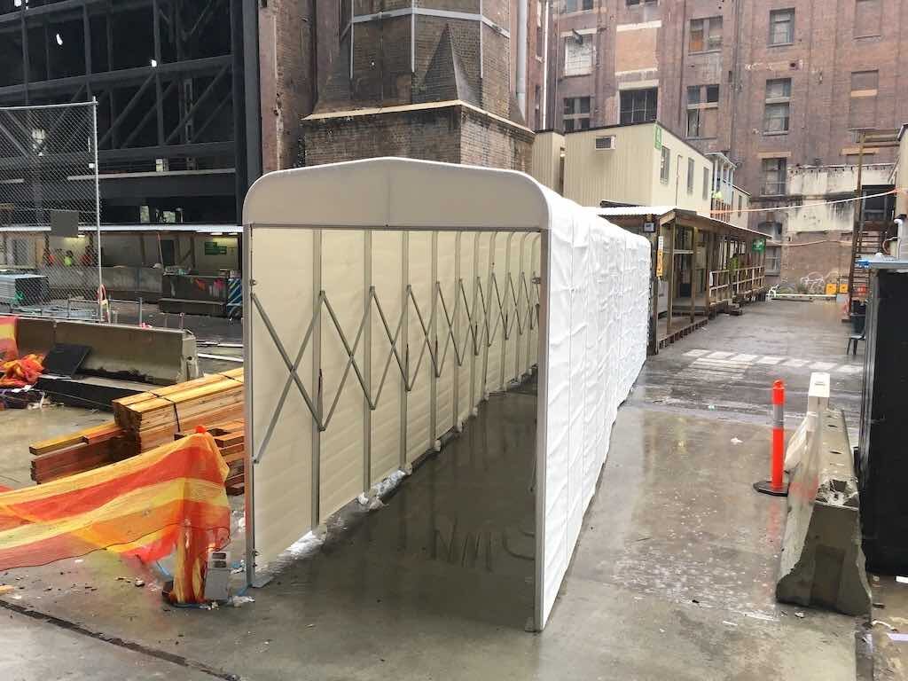 multiplex branded retractable tunnels on construction site