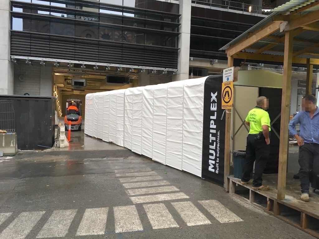 multiplex branded retractable tunnels on construction site